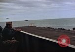 Image of General Motors FM-2 Wildcat aircraft landing on escort carrier Iwo Jima, 1945, second 40 stock footage video 65675040327