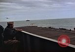 Image of General Motors FM-2 Wildcat aircraft landing on escort carrier Iwo Jima, 1945, second 41 stock footage video 65675040327