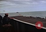 Image of General Motors FM-2 Wildcat aircraft landing on escort carrier Iwo Jima, 1945, second 42 stock footage video 65675040327
