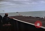 Image of General Motors FM-2 Wildcat aircraft landing on escort carrier Iwo Jima, 1945, second 43 stock footage video 65675040327