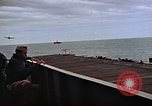 Image of General Motors FM-2 Wildcat aircraft landing on escort carrier Iwo Jima, 1945, second 44 stock footage video 65675040327