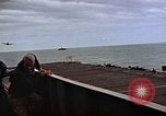 Image of General Motors FM-2 Wildcat aircraft landing on escort carrier Iwo Jima, 1945, second 45 stock footage video 65675040327