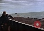 Image of General Motors FM-2 Wildcat aircraft landing on escort carrier Iwo Jima, 1945, second 46 stock footage video 65675040327