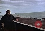 Image of General Motors FM-2 Wildcat aircraft landing on escort carrier Iwo Jima, 1945, second 47 stock footage video 65675040327