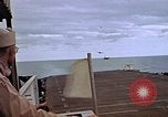 Image of General Motors FM-2 Wildcat aircraft landing on escort carrier Iwo Jima, 1945, second 48 stock footage video 65675040327
