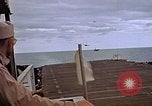 Image of General Motors FM-2 Wildcat aircraft landing on escort carrier Iwo Jima, 1945, second 49 stock footage video 65675040327