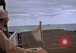 Image of General Motors FM-2 Wildcat aircraft landing on escort carrier Iwo Jima, 1945, second 50 stock footage video 65675040327