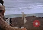 Image of General Motors FM-2 Wildcat aircraft landing on escort carrier Iwo Jima, 1945, second 51 stock footage video 65675040327