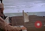 Image of General Motors FM-2 Wildcat aircraft landing on escort carrier Iwo Jima, 1945, second 54 stock footage video 65675040327