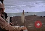 Image of General Motors FM-2 Wildcat aircraft landing on escort carrier Iwo Jima, 1945, second 55 stock footage video 65675040327