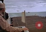 Image of General Motors FM-2 Wildcat aircraft landing on escort carrier Iwo Jima, 1945, second 56 stock footage video 65675040327