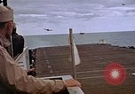 Image of General Motors FM-2 Wildcat aircraft landing on escort carrier Iwo Jima, 1945, second 57 stock footage video 65675040327