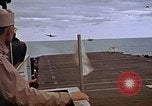Image of General Motors FM-2 Wildcat aircraft landing on escort carrier Iwo Jima, 1945, second 58 stock footage video 65675040327