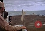 Image of General Motors FM-2 Wildcat aircraft landing on escort carrier Iwo Jima, 1945, second 59 stock footage video 65675040327
