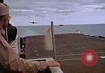 Image of General Motors FM-2 Wildcat aircraft landing on escort carrier Iwo Jima, 1945, second 60 stock footage video 65675040327