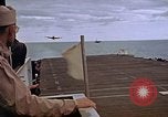 Image of General Motors FM-2 Wildcat aircraft landing on escort carrier Iwo Jima, 1945, second 61 stock footage video 65675040327