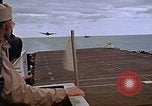 Image of General Motors FM-2 Wildcat aircraft landing on escort carrier Iwo Jima, 1945, second 62 stock footage video 65675040327