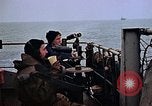 Image of Crew at work on escort carrier of Task Group 52.2  Pacific Ocean, 1945, second 14 stock footage video 65675040328