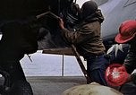 Image of Crew at work on escort carrier of Task Group 52.2  Pacific Ocean, 1945, second 50 stock footage video 65675040328