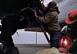 Image of Crew at work on escort carrier of Task Group 52.2  Pacific Ocean, 1945, second 52 stock footage video 65675040328