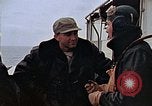 Image of Crews pushing FM-2 wildcat airplanes on escort carrier deck Iwo Jima, 1945, second 1 stock footage video 65675040329