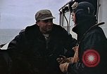 Image of Crews pushing FM-2 wildcat airplanes on escort carrier deck Iwo Jima, 1945, second 4 stock footage video 65675040329