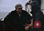 Image of Crews pushing FM-2 wildcat airplanes on escort carrier deck Iwo Jima, 1945, second 5 stock footage video 65675040329