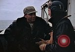 Image of Crews pushing FM-2 wildcat airplanes on escort carrier deck Iwo Jima, 1945, second 6 stock footage video 65675040329
