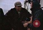 Image of Crews pushing FM-2 wildcat airplanes on escort carrier deck Iwo Jima, 1945, second 15 stock footage video 65675040329
