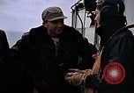 Image of Crews pushing FM-2 wildcat airplanes on escort carrier deck Iwo Jima, 1945, second 20 stock footage video 65675040329