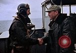 Image of Crews pushing FM-2 wildcat airplanes on escort carrier deck Iwo Jima, 1945, second 21 stock footage video 65675040329