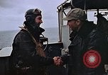 Image of Crews pushing FM-2 wildcat airplanes on escort carrier deck Iwo Jima, 1945, second 24 stock footage video 65675040329
