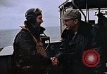 Image of Crews pushing FM-2 wildcat airplanes on escort carrier deck Iwo Jima, 1945, second 25 stock footage video 65675040329