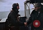 Image of Crews pushing FM-2 wildcat airplanes on escort carrier deck Iwo Jima, 1945, second 27 stock footage video 65675040329