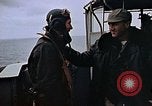 Image of Crews pushing FM-2 wildcat airplanes on escort carrier deck Iwo Jima, 1945, second 28 stock footage video 65675040329
