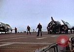 Image of Crews pushing FM-2 wildcat airplanes on escort carrier deck Iwo Jima, 1945, second 29 stock footage video 65675040329