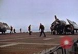 Image of Crews pushing FM-2 wildcat airplanes on escort carrier deck Iwo Jima, 1945, second 31 stock footage video 65675040329