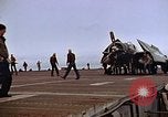 Image of Crews pushing FM-2 wildcat airplanes on escort carrier deck Iwo Jima, 1945, second 32 stock footage video 65675040329