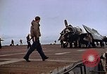 Image of Crews pushing FM-2 wildcat airplanes on escort carrier deck Iwo Jima, 1945, second 33 stock footage video 65675040329