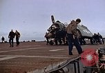 Image of Crews pushing FM-2 wildcat airplanes on escort carrier deck Iwo Jima, 1945, second 35 stock footage video 65675040329
