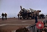 Image of Crews pushing FM-2 wildcat airplanes on escort carrier deck Iwo Jima, 1945, second 36 stock footage video 65675040329