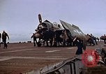 Image of Crews pushing FM-2 wildcat airplanes on escort carrier deck Iwo Jima, 1945, second 37 stock footage video 65675040329