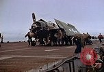 Image of Crews pushing FM-2 wildcat airplanes on escort carrier deck Iwo Jima, 1945, second 38 stock footage video 65675040329