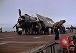 Image of Crews pushing FM-2 wildcat airplanes on escort carrier deck Iwo Jima, 1945, second 39 stock footage video 65675040329