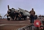 Image of Crews pushing FM-2 wildcat airplanes on escort carrier deck Iwo Jima, 1945, second 40 stock footage video 65675040329