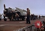 Image of Crews pushing FM-2 wildcat airplanes on escort carrier deck Iwo Jima, 1945, second 41 stock footage video 65675040329