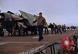 Image of Crews pushing FM-2 wildcat airplanes on escort carrier deck Iwo Jima, 1945, second 42 stock footage video 65675040329