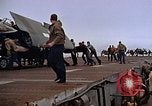 Image of Crews pushing FM-2 wildcat airplanes on escort carrier deck Iwo Jima, 1945, second 44 stock footage video 65675040329