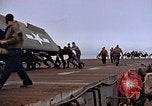 Image of Crews pushing FM-2 wildcat airplanes on escort carrier deck Iwo Jima, 1945, second 45 stock footage video 65675040329