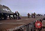 Image of Crews pushing FM-2 wildcat airplanes on escort carrier deck Iwo Jima, 1945, second 46 stock footage video 65675040329